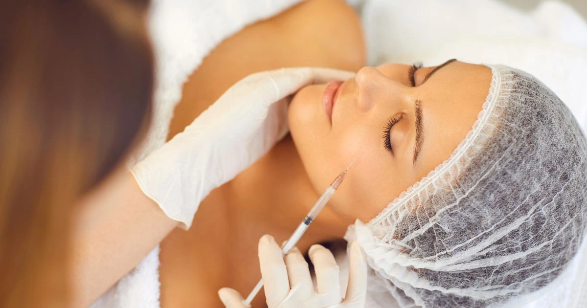 A medical professional administers an injectable treatment for Peptide Therapy skin rejuvenation and anti-aging.